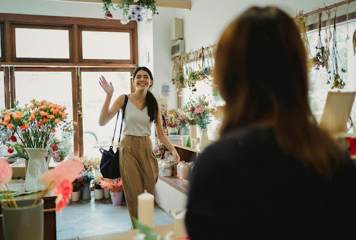 Happy customer returning to flower shop